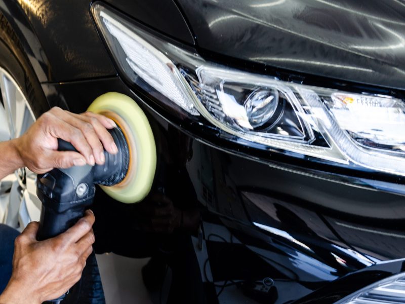 Car detailing.Man hand holding and polish the car.